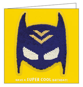 A card and a birthday gift in one! This birthday card features a superhero mask sequin patch that can be removed and added to bags, jackets and more. Text on the front of the card reads "Have a SUPER COOL Birthday!"