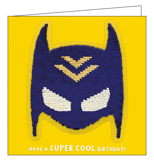 A card and a birthday gift in one! This birthday card features a superhero mask sequin patch that can be removed and added to bags, jackets and more. Text on the front of the card reads 