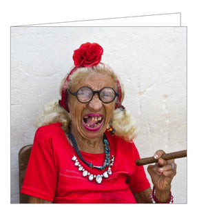 This card is decorated with one of Track's Publishing's best known images - an elderly lady, gap-toothed in red clothing and heavy jewellery, smoking a cigar. 