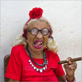 This card is decorated with one of Track's Publishing's best known images - an elderly lady, gap-toothed in red clothing and heavy jewellery, smoking a cigar. 