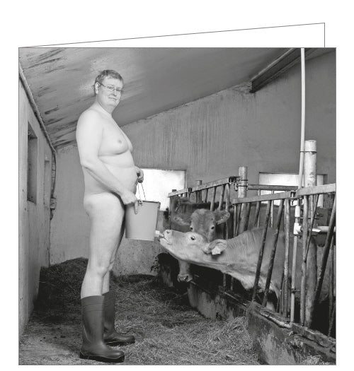 Perfect for farmers. This cheeky card from the Naughty By Nature greetings card range is decorated with a black and white photograph of a naked farmer, feeding a cow milk from a well-positioned bucket.