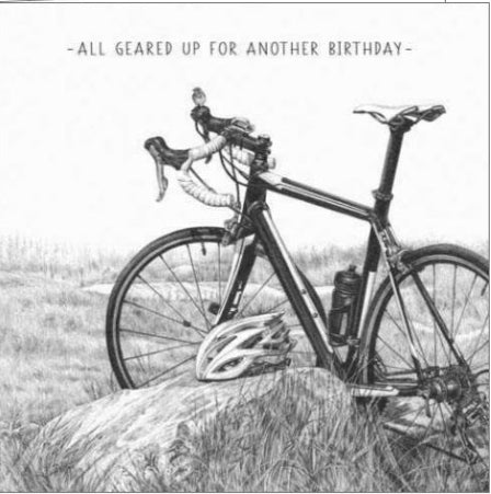 This eye catching birthday card from Pigment Production's Life in Pencil card range is decorated with a black and white sketch of a bike out in the countryside. The caption on the front of the card reads "All geared up for another Birthday".