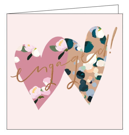 This lovely engagement card from Woodmansterne cards collaboration with designer Stephanie Dyment is decorated with a pair of overlapping love hearts, covered in flowers and confettis. Rose gold text on the front of the card reads 