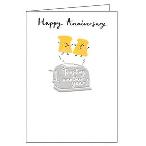 This cute anniversary card is decorated with two smiling slices of toast leaping up from a metallic toaster. Text on the front of the card reads "Happy Anniversary...toasting another year!"