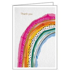This thank you card is decorated with a brightly coloured, patterned rainbow. Gold text on the card reads "Thank you".