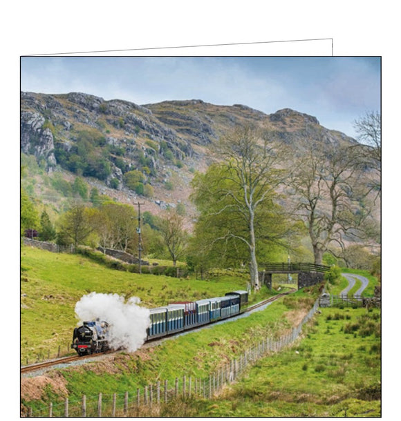 This blank card by the National Trust features a colour photograph of the narrow-gauge 'La'al Ratty' steam train chugging along the 7-mile track of the heritage Ravenglass and Eskdale railway in Cumbria, England.This blank card by the National Trust features a colour photograph of the narrow-gauge 'La'al Ratty' steam train chugging along the 7-mile track of the heritage Ravenglass and Eskdale railway in Cumbria, England.