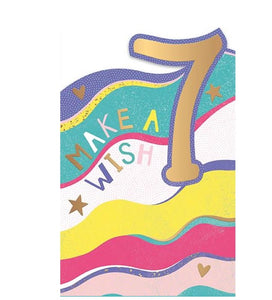 This 7th birthday card is decorated with gold, pink and yellow waves. The text on the front of the card reads "Make a Wish 7". 