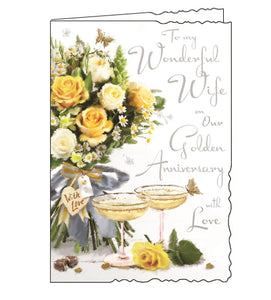 Jonny Javelin cards combine detailed illustrations with heartfelt messages. This Golden Anniversary card for a very special wife is illustrated with a table set with a bouquet of cream and yellow roses and two champagne coupes filled with fizz. The text on the front of the card reads "To my Wonderful Wife on our Golden Anniversary with Love".