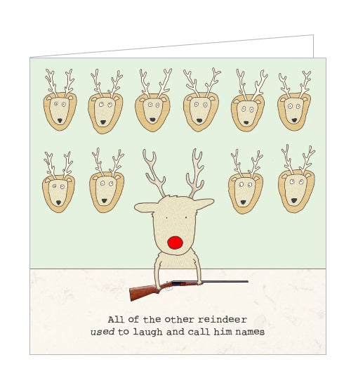 This Christmas card features one of Rosie Made a Thing's unmistakably witty and charming illustrations showing Rudolph the red-nosed reindeer holding a rifle, with deer heads mounted on the wall behind him. The caption on the front of the card reads 