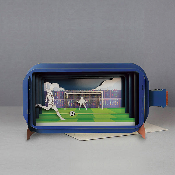 This fabulous pop-up greetings card is made of multiple layers of laser cut card to create a wonderful 3d image that is perfect for Father's Day, showing a footballer about to kick a football straight into a goal.