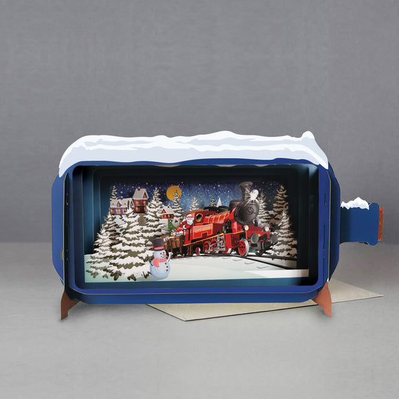This fabulous 3d christmas card is made of multiple layers of laser cut card to create a wonderful 3d image of father christmas driving a red steam train through a snowy landscape - inside of a snow-topped bottle.
